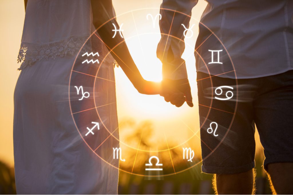 roue signes du zodiacal pour l'horoscope avec un couple se tenant la main dans le fond